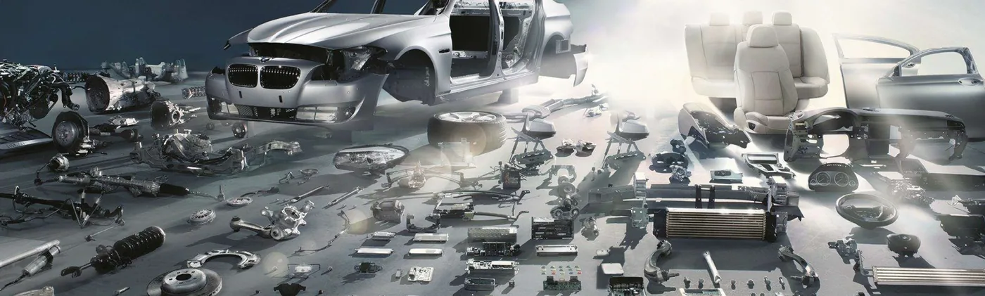 Close-up view of various automotive parts, including engine components, brake systems, and a car body, highlighting the intricate details and functionality...